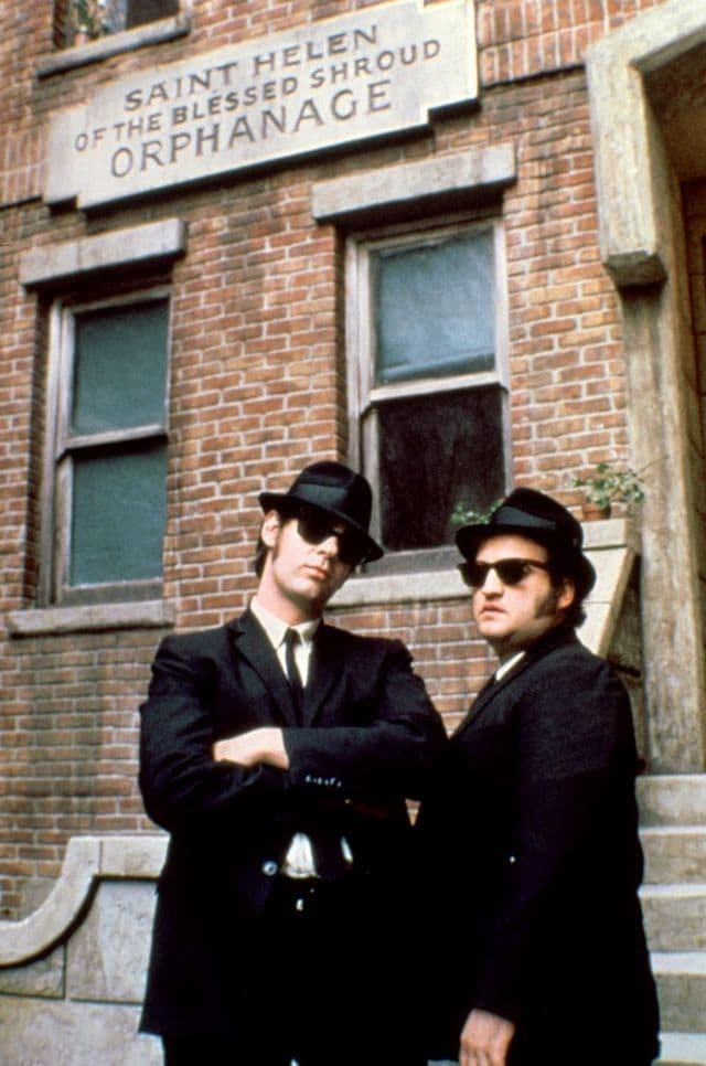 John Belushi and Dan Aykroyd wear Wayfarer sunglasses in The Blues Brothers Movie